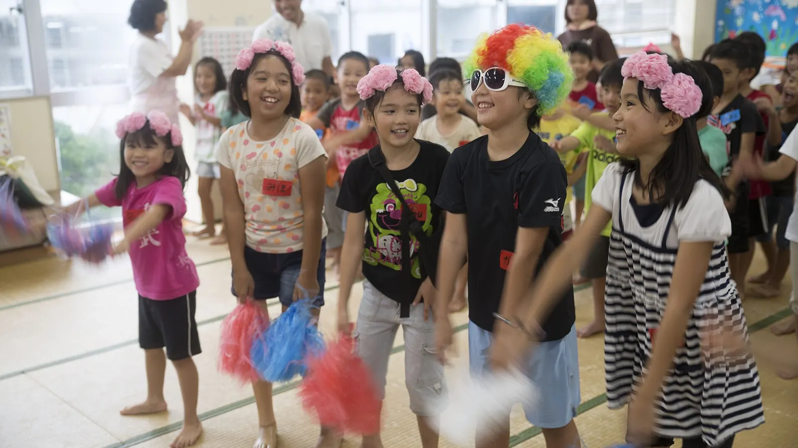 Children singing and playing together at a community program