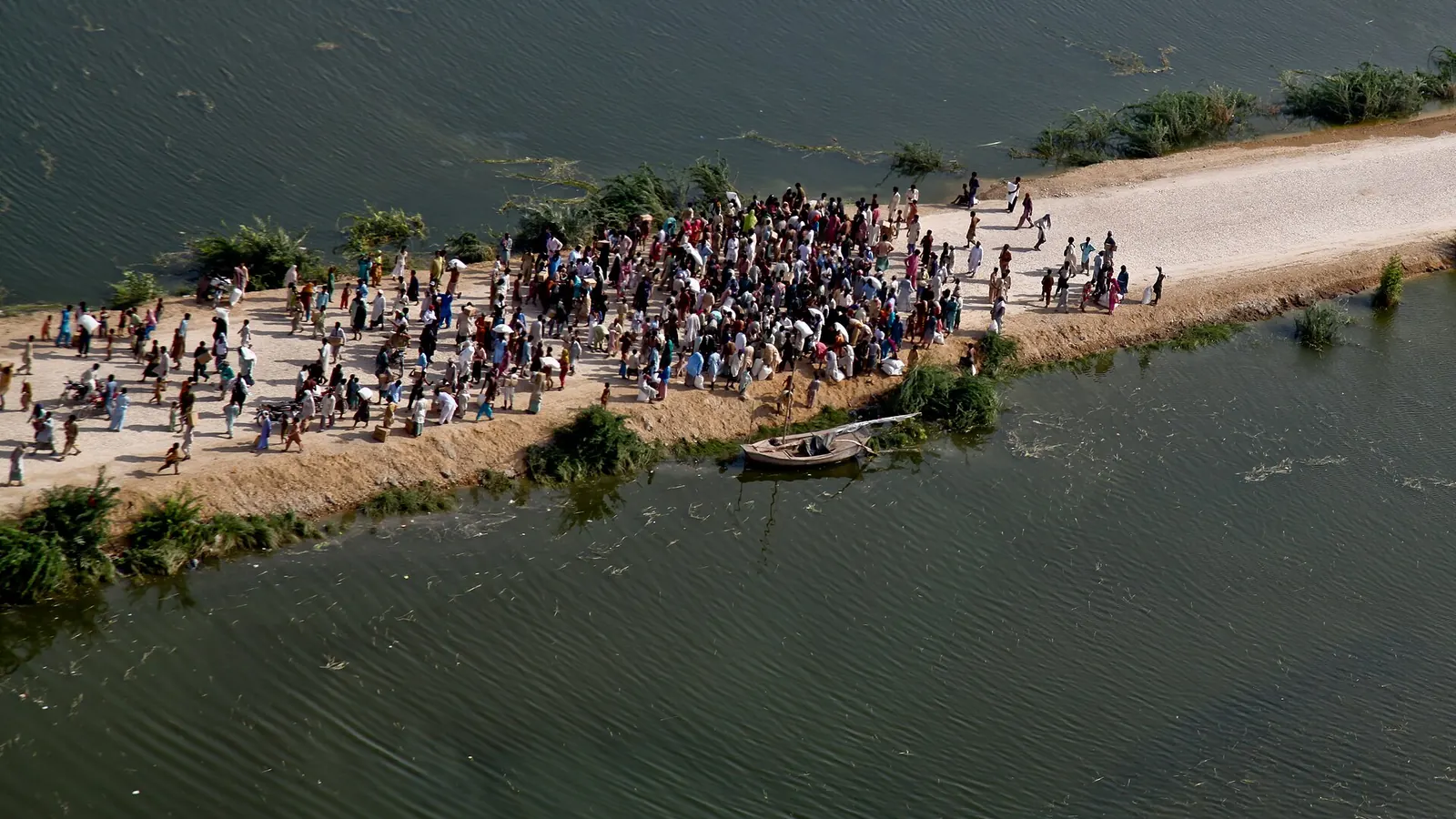 Emergency tents beside floodwaters in rural Pakistan